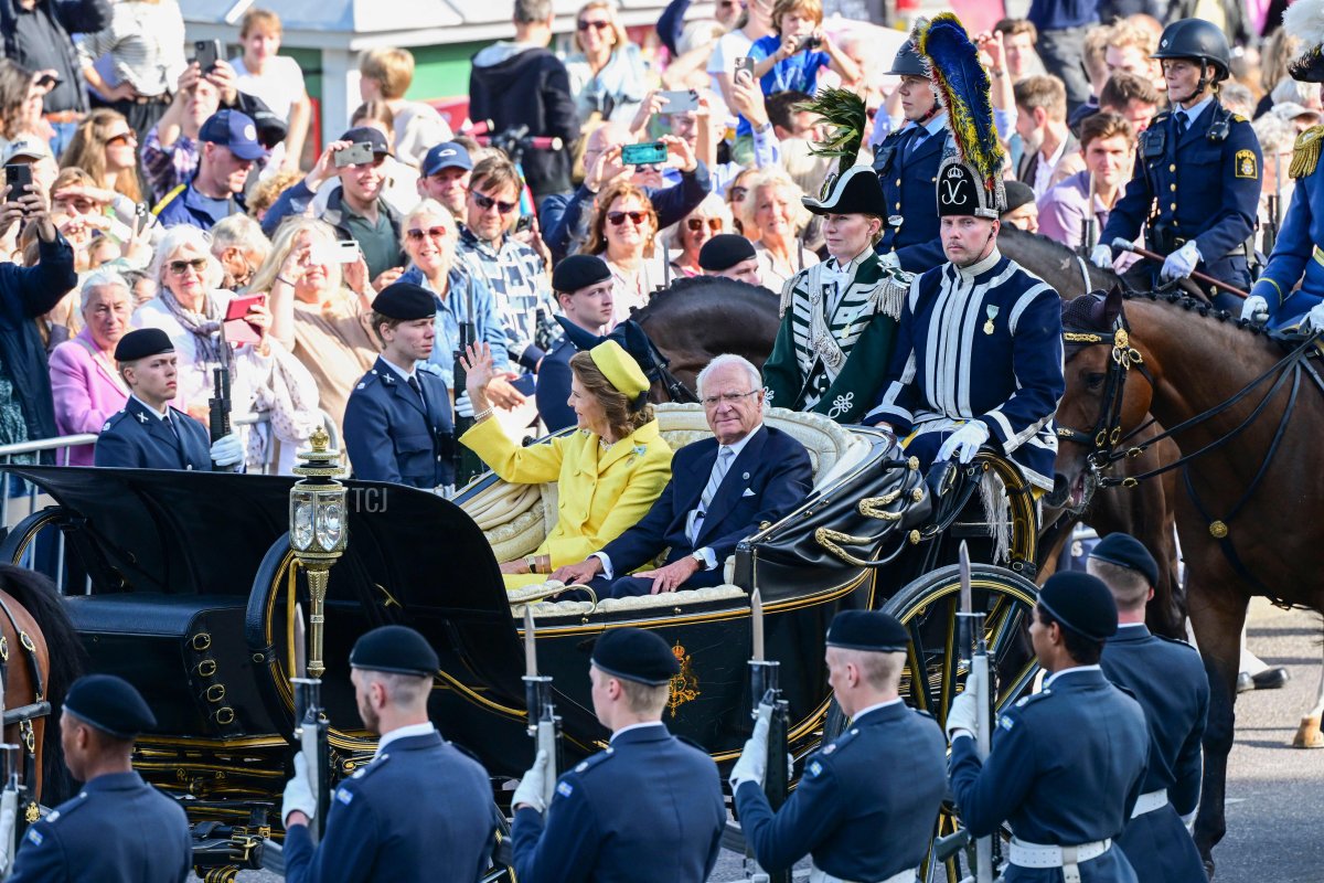 King Carl XVI Gustaf and Queen Silvia of Sweden ride through Stockholm in an open carriage during the Golden Jubilee procession on September 16, 2023 (JONAS EKSTROMER/TT NEWS AGENCY/AFP via Getty Images)