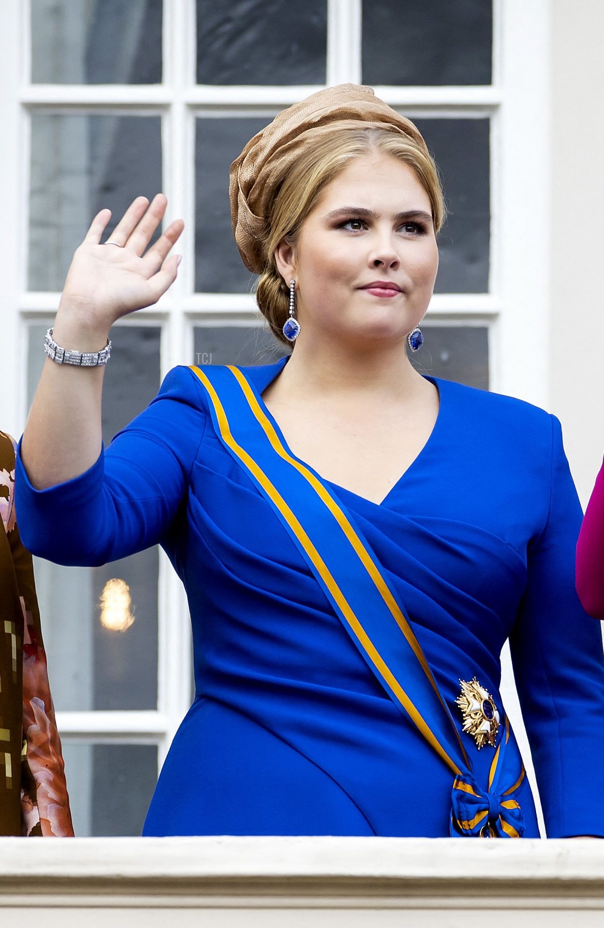 Princess Amalia of the Netherlands waves from the balcony of Noordeinde Palace on Prinsjesdag in The Hague on September 19, 2023 (KOEN VAN WEEL/ANP/AFP via Getty Images)