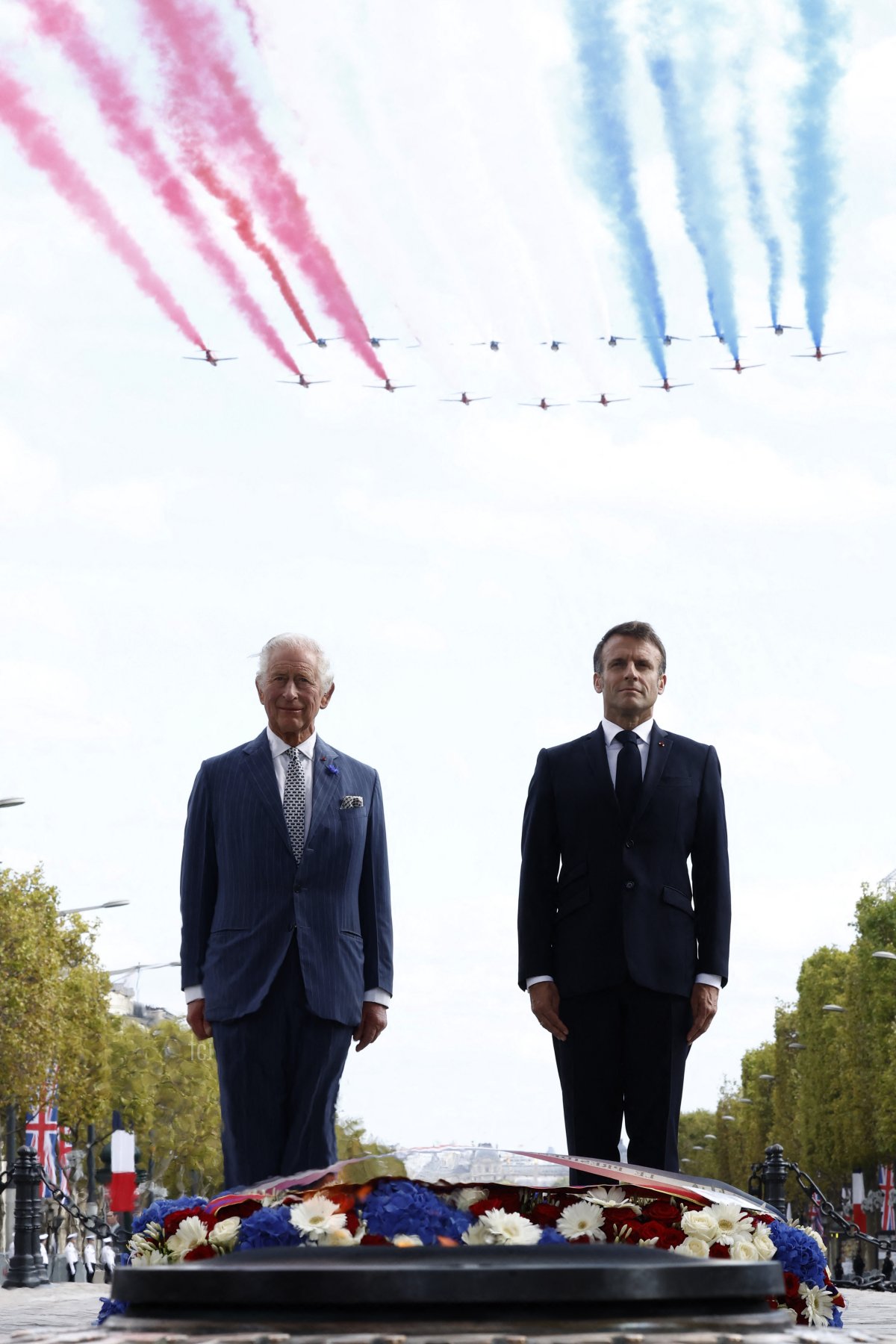 King Charles III of the United Kingdom and President Emmanuel Macron participate in a wreath-laying ceremony at the Arc de Triomphe in Paris during an official welcome ceremony at the start of a state visit to France on September 20, 2023 (YOAN VALAT/POOL/AFP via Getty Images)