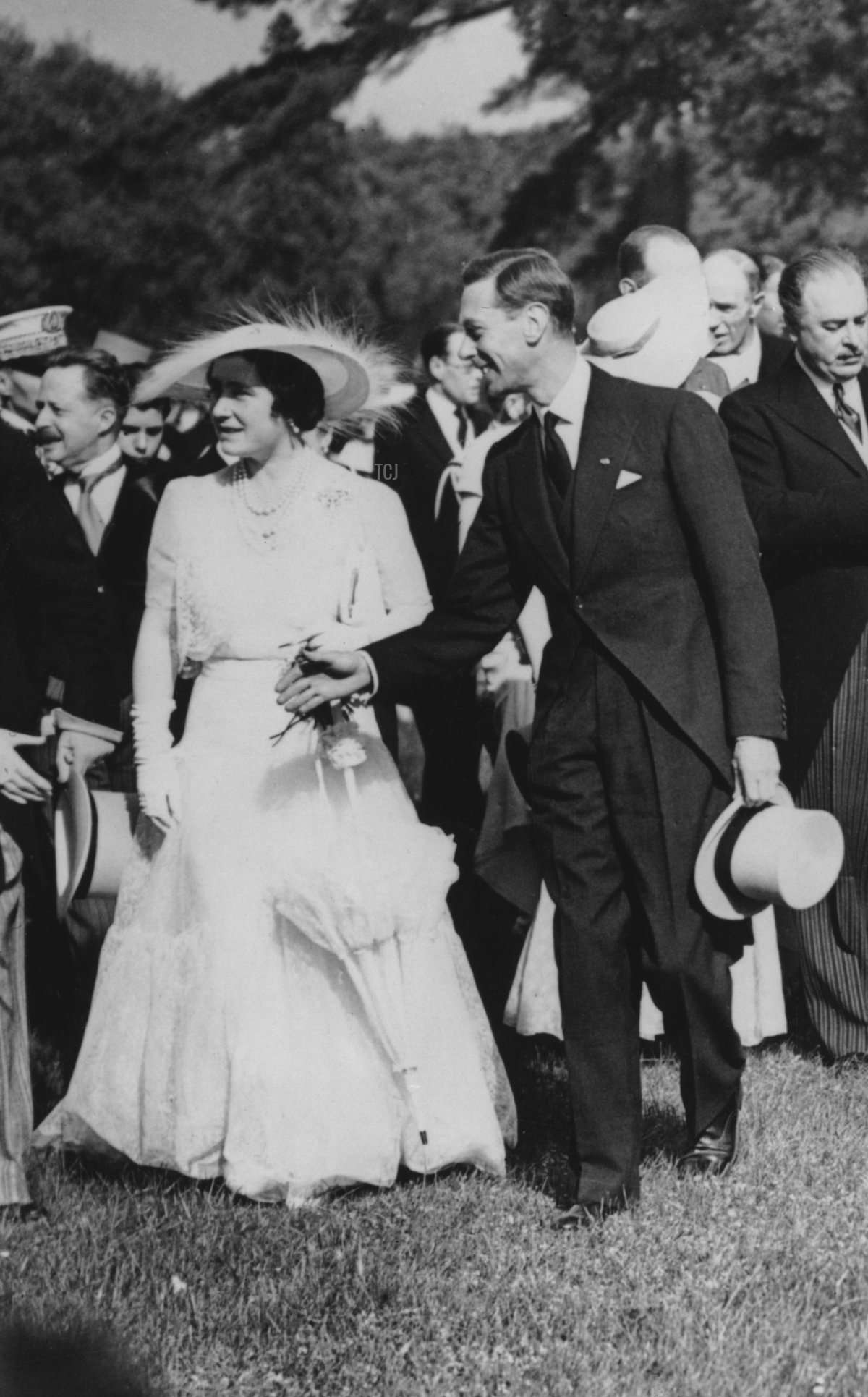 King George VI and Queen Elizabeth of the United Kingdom attend a garden party at the Château de Bagatelle in the Bois de Boulogne during their state visit to France, July 1938 (Topical Press Agency/Hulton Archive/Getty Images)