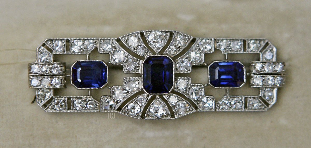 An Art Deco sapphire and diamond brooch sits on display during ahead of the sale of jewelry and works of art from the collection of Princess Margaret at Christie's on June 9, 2006 in London (Scott Barbour/Getty Images)