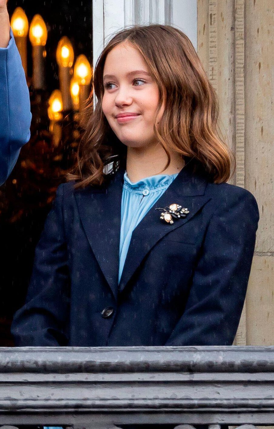 Princess Josephine of Denmark waves from the balcony of Amalienborg Palace during Prince Christian's 18th birthday celebrations in Copenhagen on October 15, 2023 (Patrick van Katwijk/DPA Picture Alliance/Alamy)