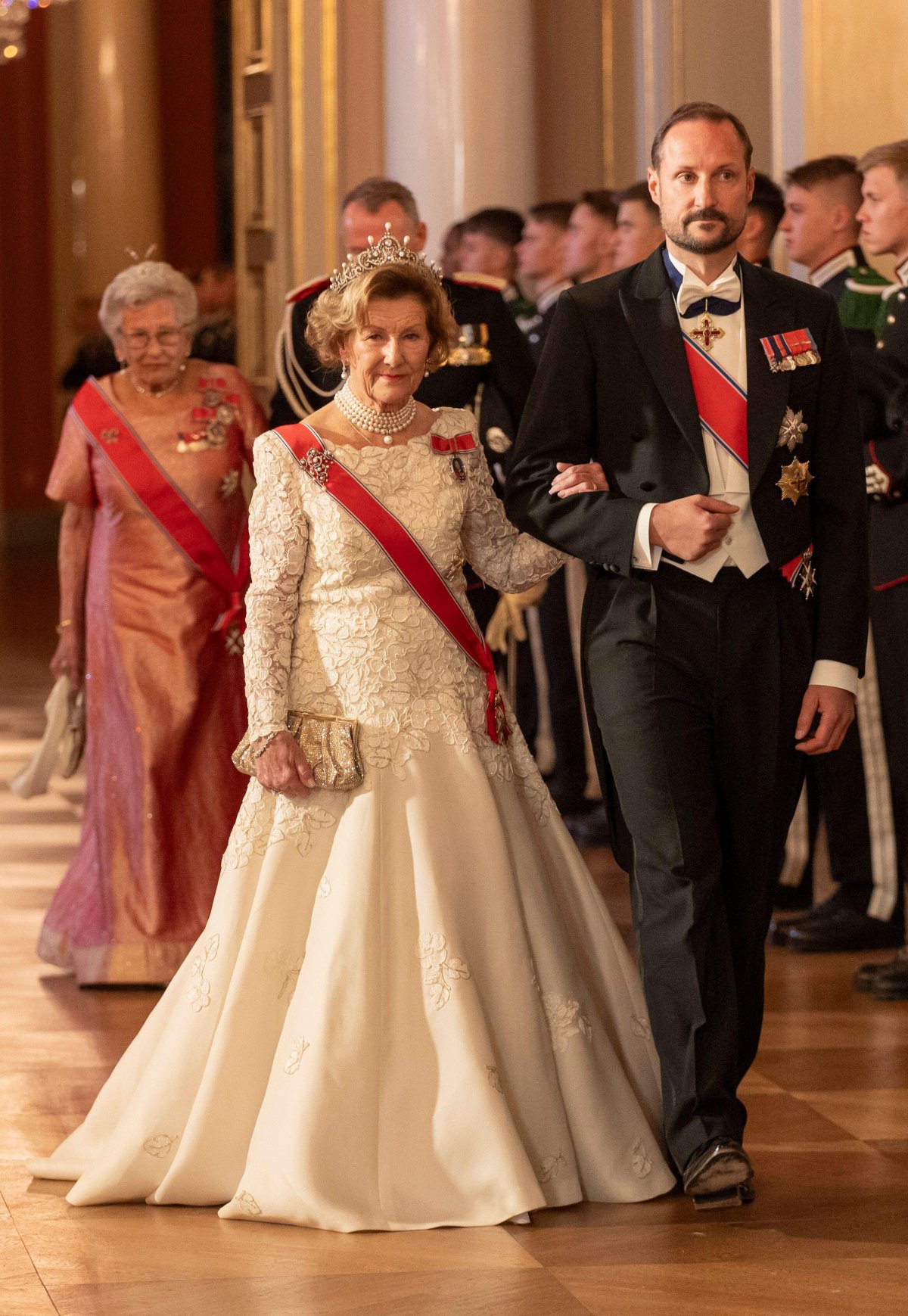 The Queen of Norway, the Crown Prince of Norway, and Princess Astrid attend a gala dinner for representatives of the Storting at the Royal Palace in Oslo on October 26, 2023 (Frederik Ringnes/NTB/Alamy)