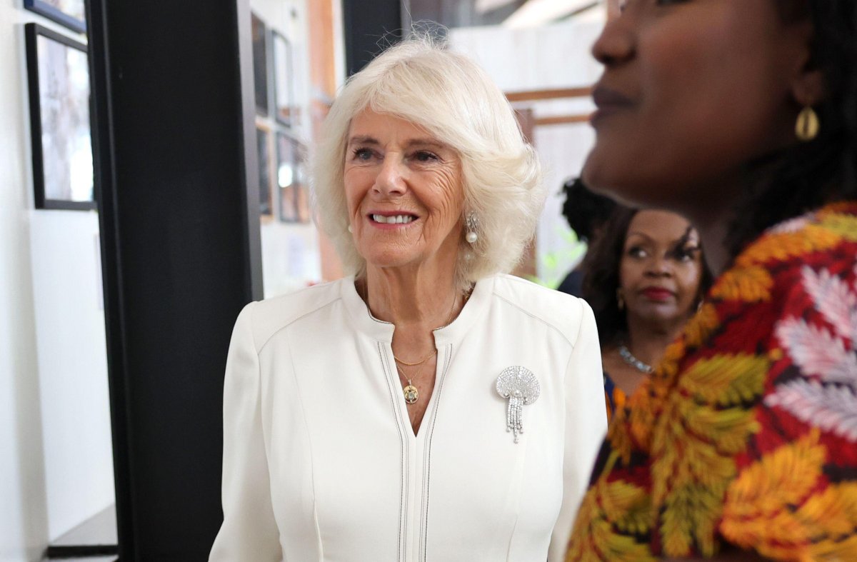 Queen Camilla views the Camp Toyoyo exhibition wall during a visit to the Eastlands Library in Nairobi on October 31, 2023 (Chris Jackson/PA Images/Alamy)