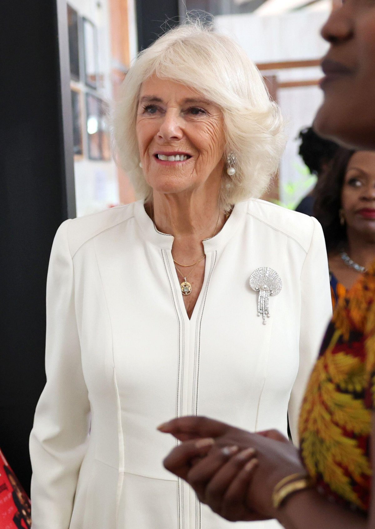 Queen Camilla views the Camp Toyoyo exhibition wall during a visit to the Eastlands Library in Nairobi on October 31, 2023 (Chris Jackson/PA Images/Alamy)