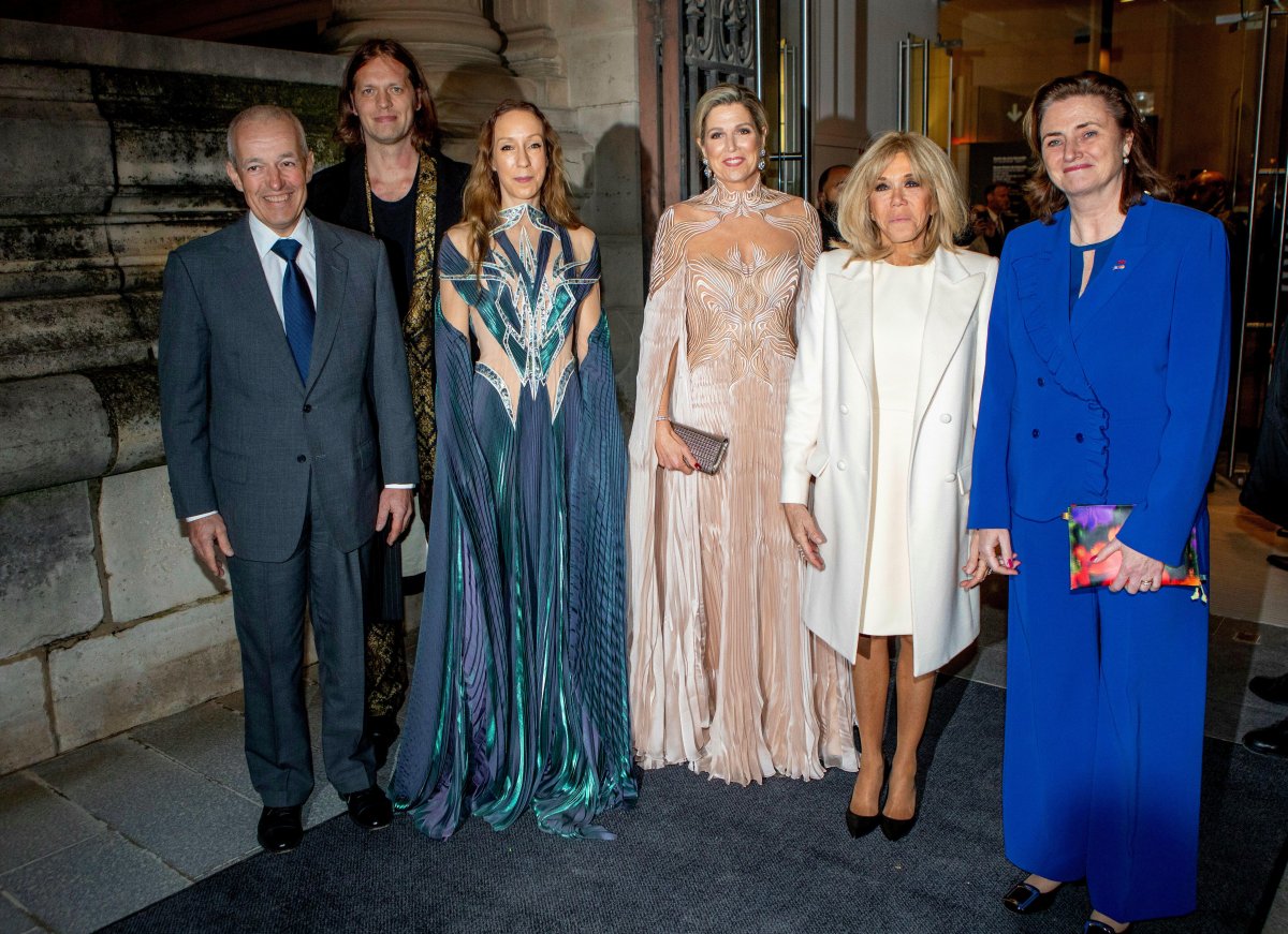 Queen Maxima of the Netherlands, with Johannes Huth, Salvador Breed, Iris van Herpen, Brigitte Macron, and Karien van Gennip, opens a new exhibition, "Iris van Herpen: Sculpting the Senses," at the Musee des Arts Decoratifs in Paris on November 28, 2023 (Albert Nieboer/DPA Picture Alliance/Alamy)
