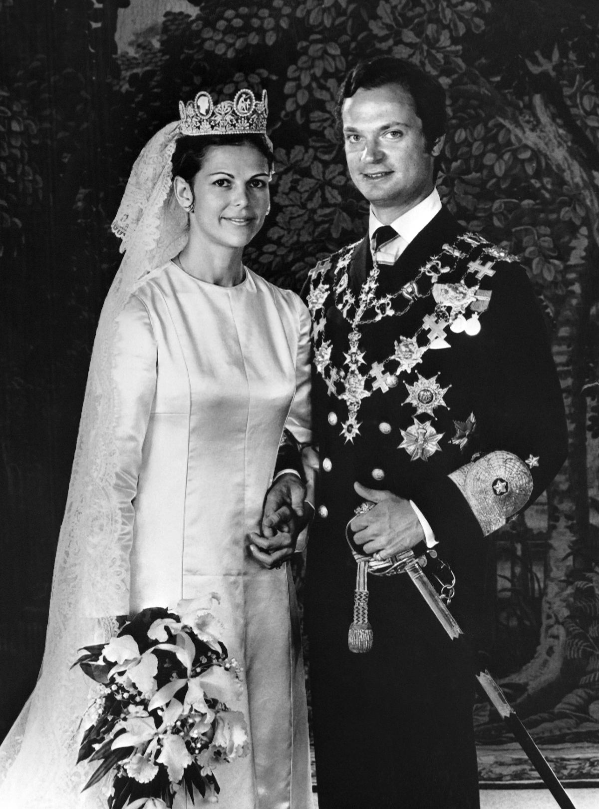 King Carl XVI Gustaf and Queen Silvia of Sweden pose for an official portrait after their royal wedding in Stockholm on June 19, 1976 (AFP via Getty Images)