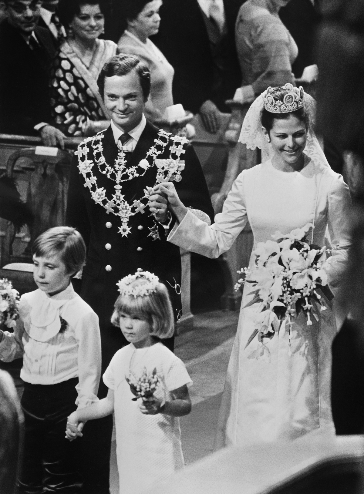 King Carl XVI Gustaf and Silvia Sommerlath are pictured during their royal wedding in Stockholm on June 19, 1976 (AFP via Getty Images)