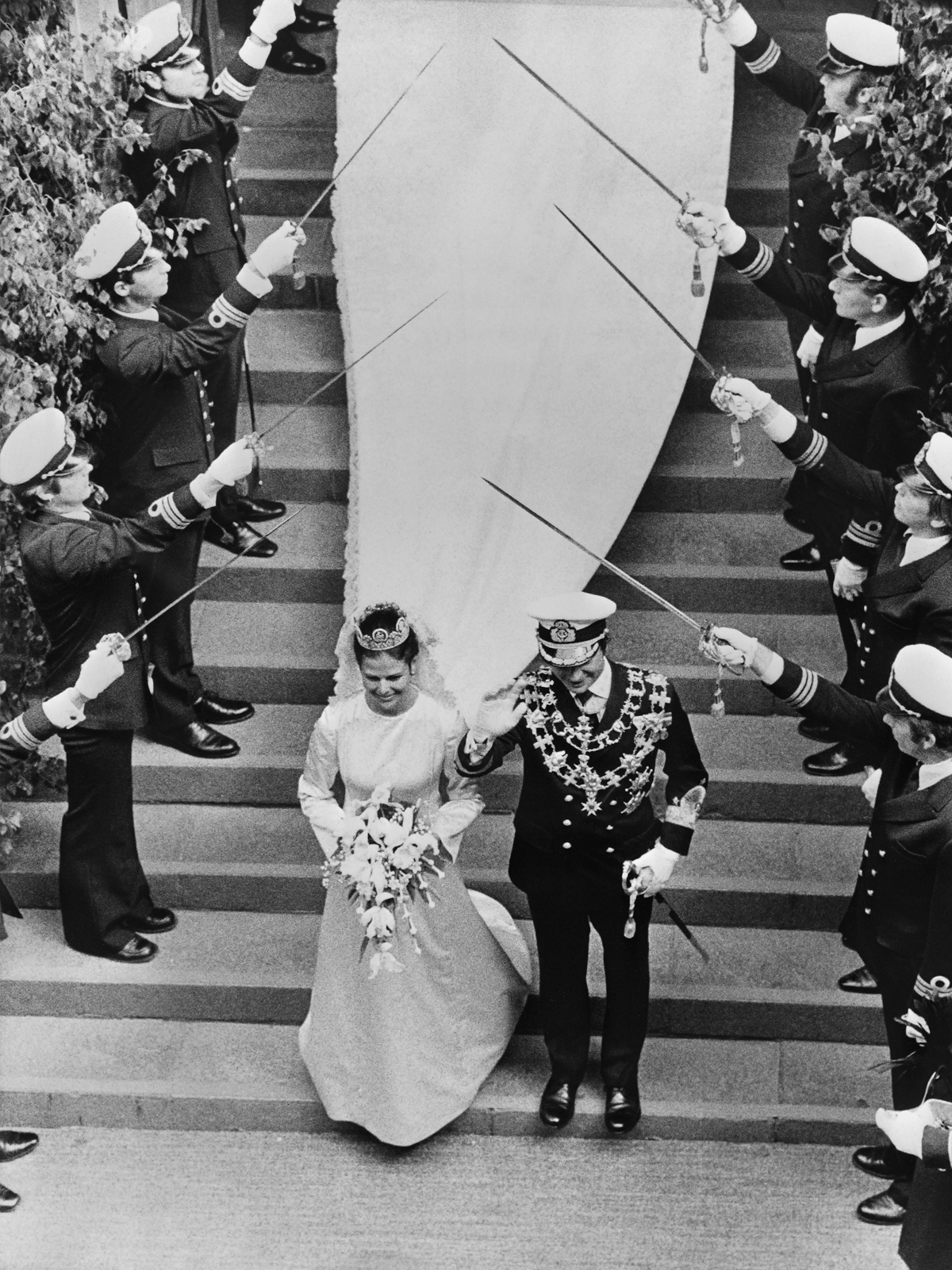 King Carl XVI Gustaf and Queen Silvia of Sweden leave the Storkyrken after their royal wedding in Stockholm on June 19, 1976 (AFP via Getty Images)