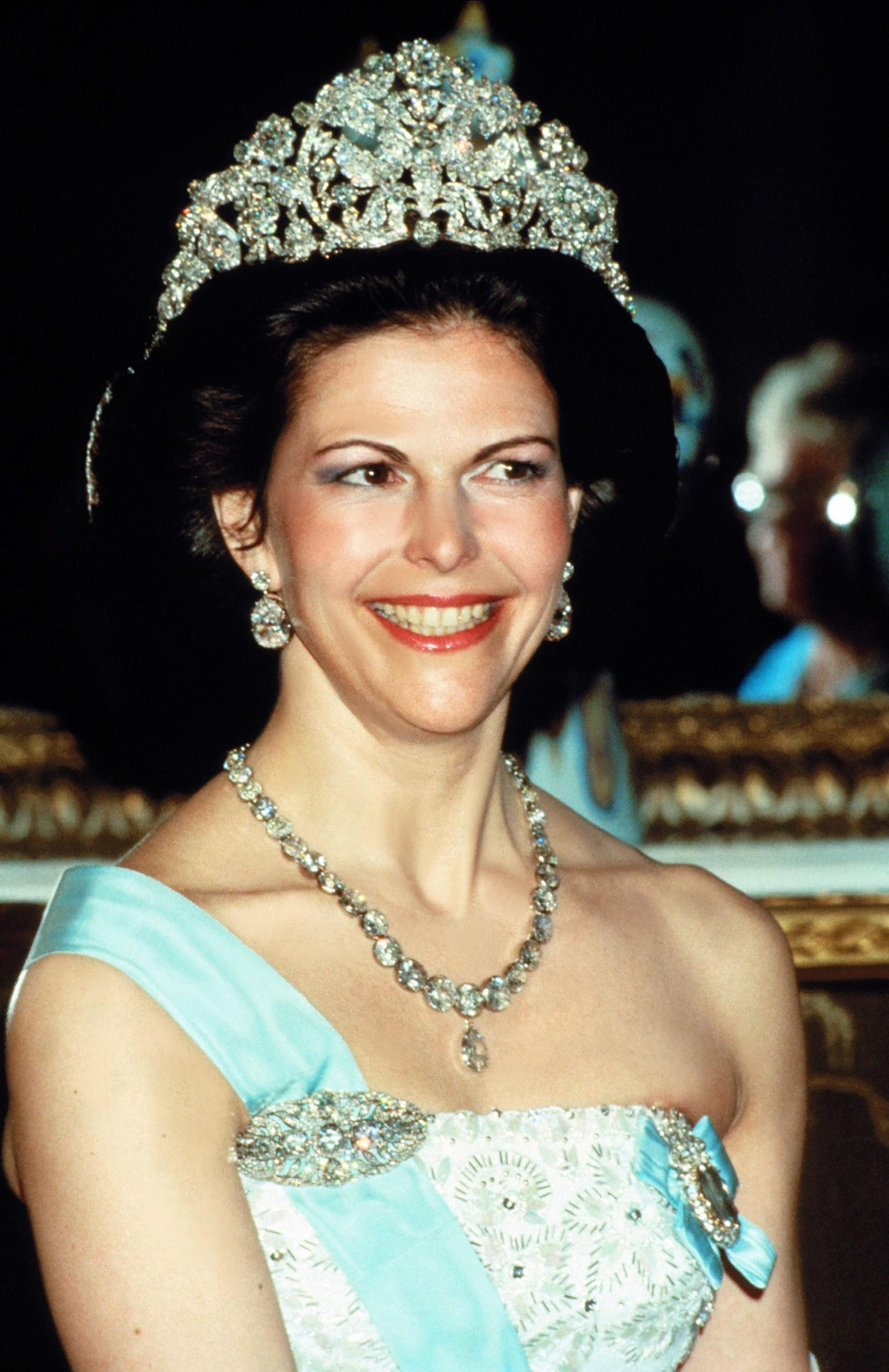 Queen Silvia of Sweden attends a state banquet in Stockholm during the British state visit to Sweden, May 1983 (AF Archive/Alamy)