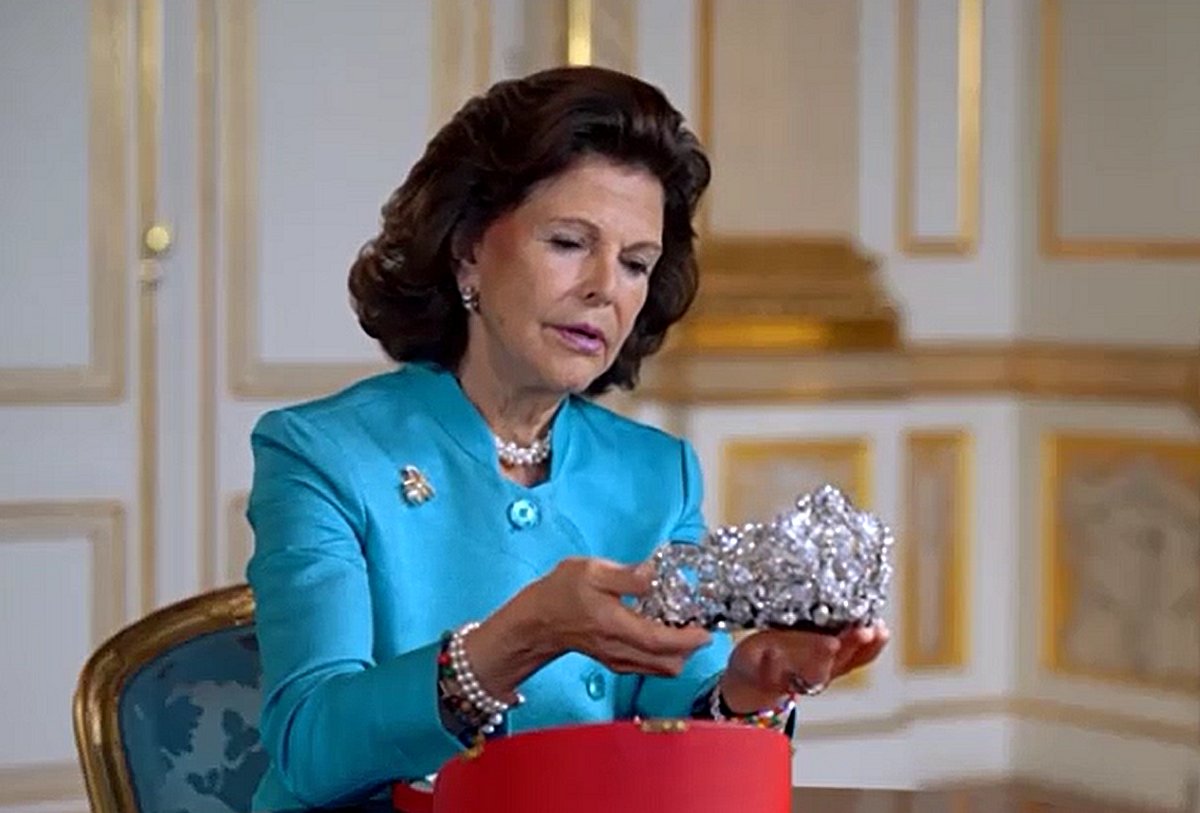 Queen Silvia of Sweden holds the Braganza Tiara in a still image from the documentary Kungliga Smycken, 2020 (SVT)