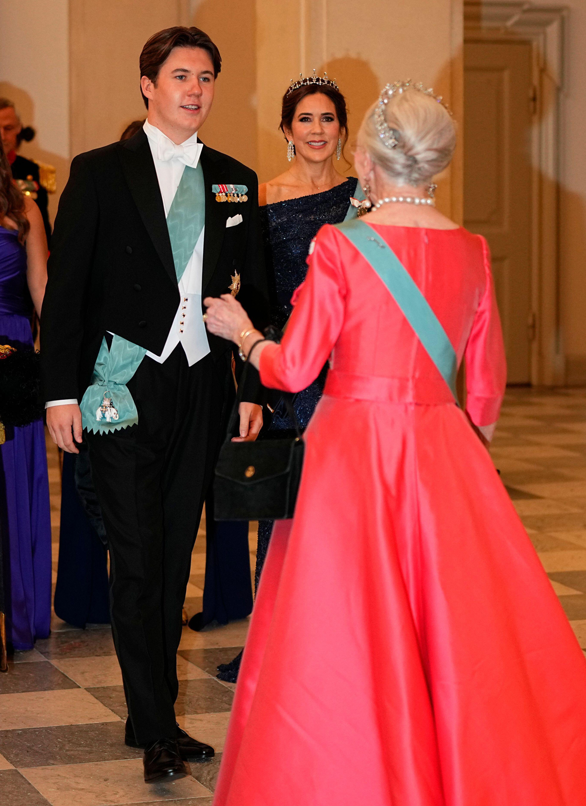 Queen Margrethe II of Denmark greets Prince Christian and Crown Princess Mary as they arrive for his 18th birthday gala at Christiansborg Palace in Copenhagen on October 15, 2023 (Mads Claus Rasmussen/Scanpix/Alamy)