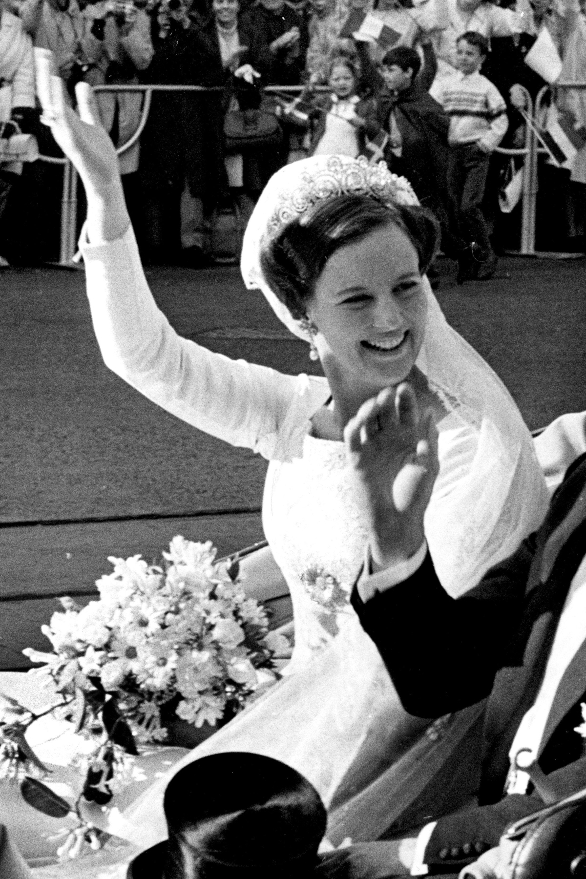 Crown Princess Margrethe of Denmark waves from a carriage on her wedding day in Copenhagen, June 10, 1967 (Jan Bjorsell/TT News Agency/Alamy)