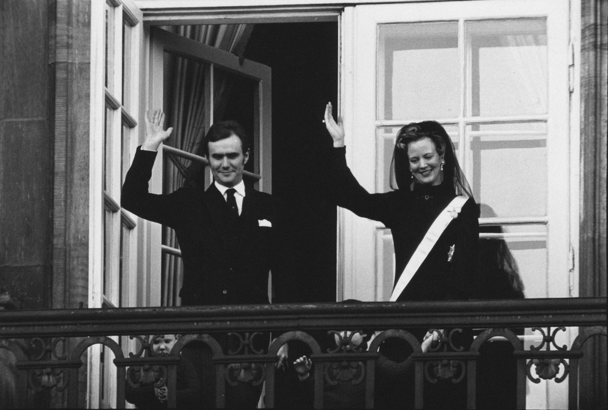 Queen Margrethe II and Prince Henrik of Denmark wave from the balcony of Amalienborg Palace in Copenhagen after she was proclaimed Queen on January 15, 1972 (Ritzau/Alamy)
