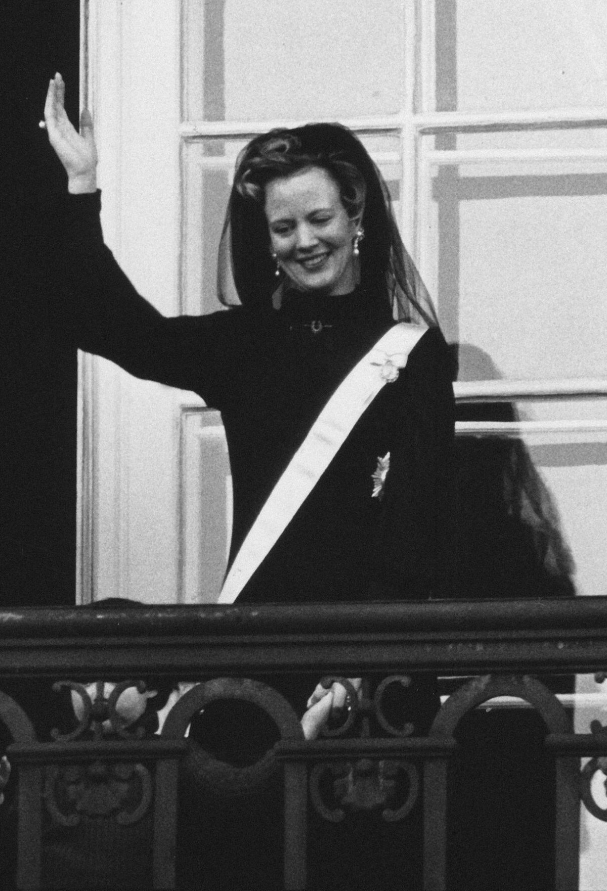 Queen Margrethe II of Denmark waves from the balcony of Amalienborg Palace in Copenhagen after she was proclaimed Queen on January 15, 1972 (Ritzau/Alamy)