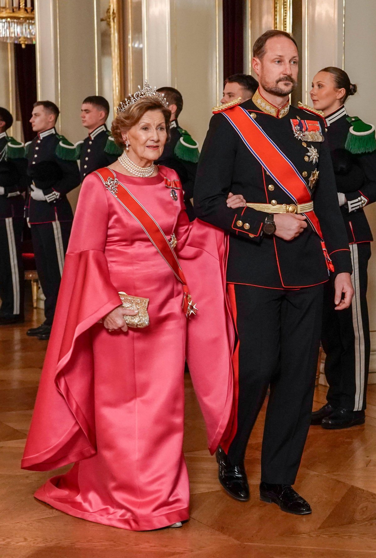Queen Sonja and Crown Prince Haakon of Norway arrive for a state banquet in honor of President Samia Suluhu Hassan of Tanzania at the Royal Palace in Oslo on February 13, 2024 (Ørn E. Borgen/NTB/Alamy)