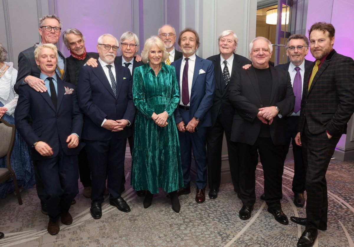 Queen Camilla of the United Kingdom is pictured with Alex Jennings, Freddie Fox, Jeremy Irons, Brian Cox, Sir Tom Courtenay, Peter Egan, Robert Lindsay, Martin Jarvis, Sir Simon Russell Beale, Robert Powell, and Samuel West during a "Celebration of Shakespeare" event at Grosvenor House in London on February 14, 2024 (Chris Jackson/PA Images/Alamy)