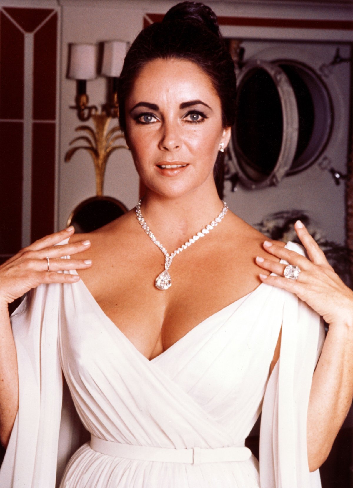 Elizabeth Taylor wears the Taylor-Burton Diamond (set as the pendant on a diamond necklace) and the Elizabeth Taylor Diamond Ring (Pictorial Press/Alamy)