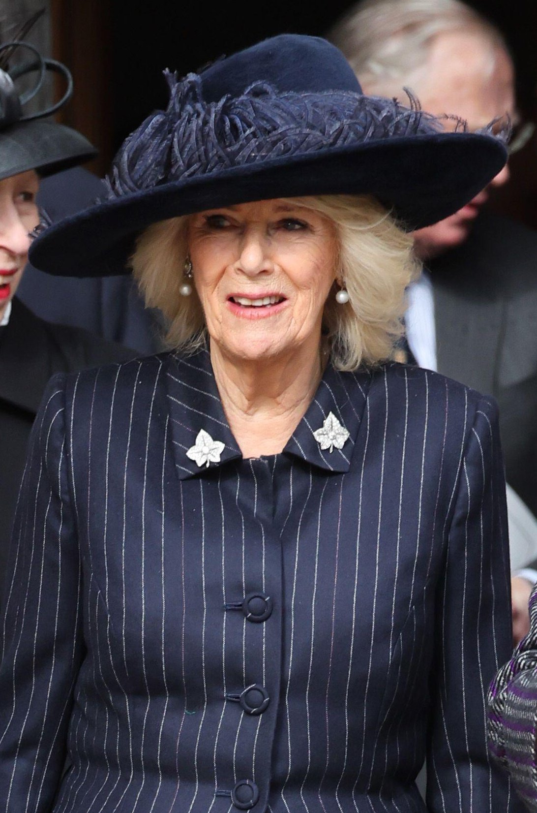 Queen Camilla of the United Kingdom departs after a memorial service in honor of the late King Constantine II of Greece at St. George's Chapel, Windsor on February 27, 2024 (Chris Jackson/PA Images/Alamy)