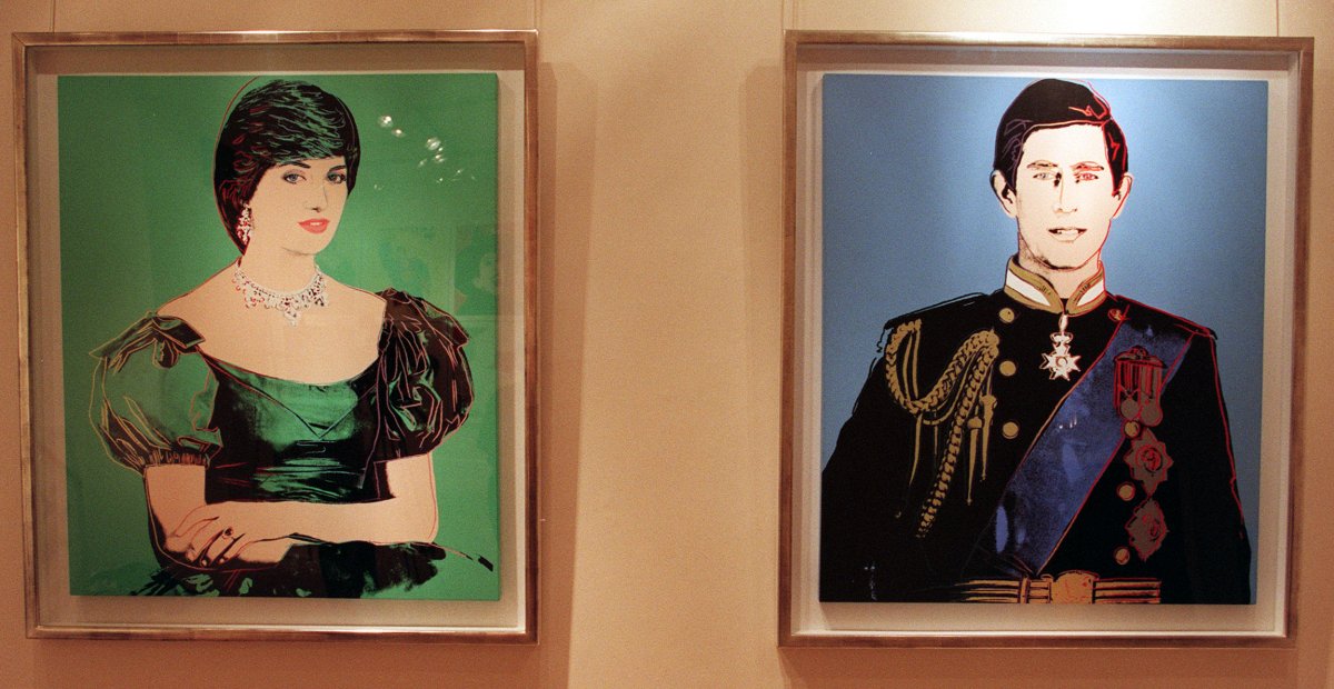 Andy Warhol's 1982 Portrait of Princess Diana and Portrait of Prince Charles, part of the collection of Lord Archer, are displayed in London on October 3, 1998 (Peter Jordan/PA Images/Alamy)