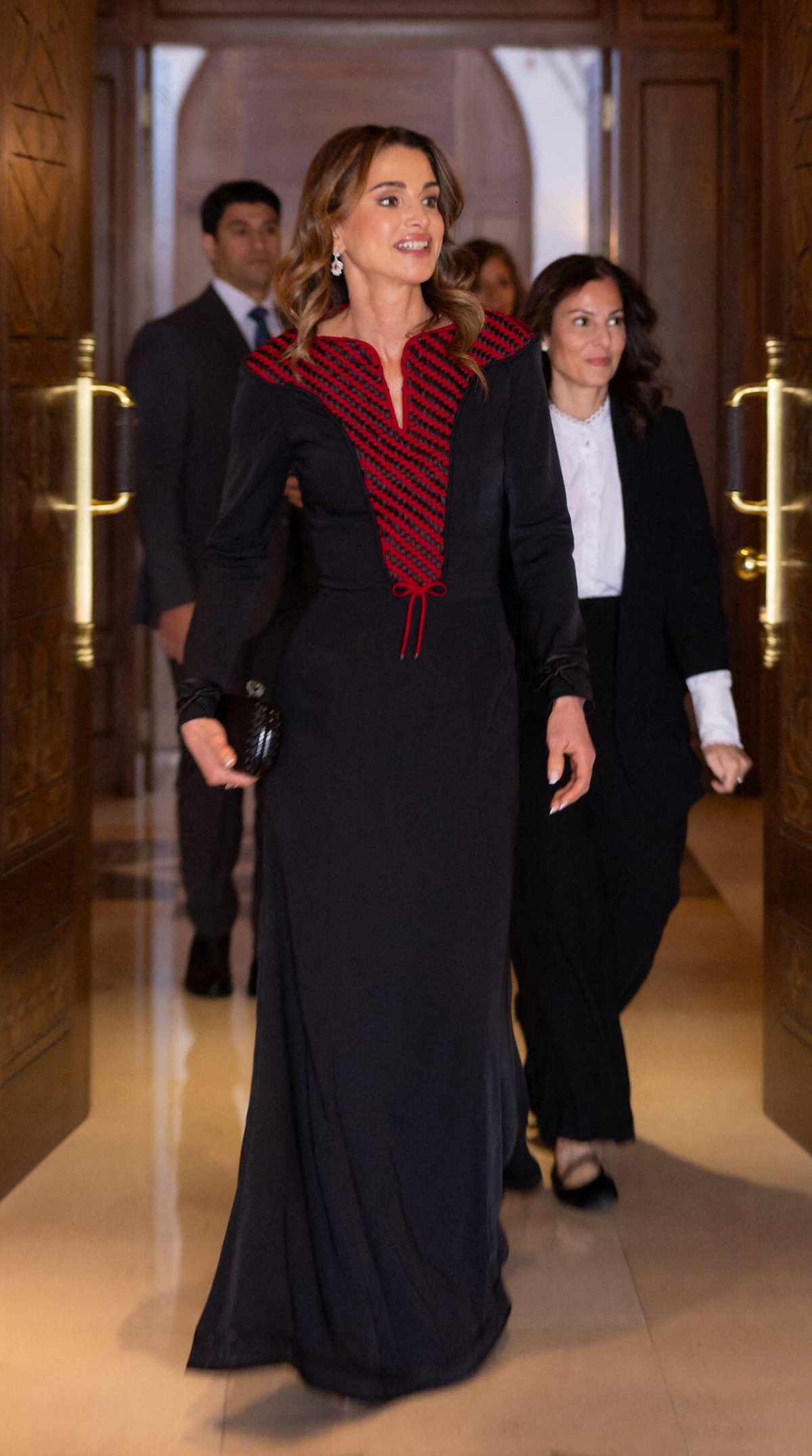 The Queen of Jordan receives the insignia of the Order of the Renaissance from her husband, King Abdullah II, on March 6, 2024 (Balkis Press/Abaca Press/Alamy)