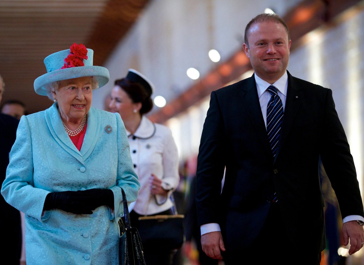 Queen Elizabeth II of the United Kingdom and Maltese Prime Minister Joseph Muscat arrive for the opening ceremony of the Commonwealth Heads of Government Meeting (CHOGM) in Valletta, Malta, on November 27, 2015 (Jin Yu/Xinhua/Alamy)