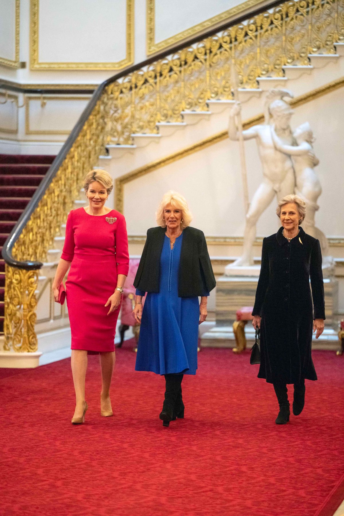 Queen Mathilde of the Belgians, the Duchess of Gloucester, and Queen Camilla attend a Women of the World (WOW) reception to celebrate International Women's Day at Buckingham Palace on March 12, 2024 (Paul Grover/PA Images/Alamy)