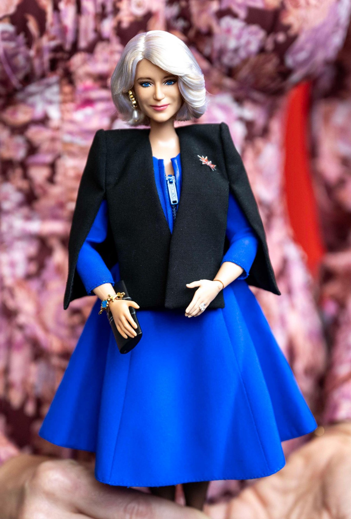 A Barbie doll designed to resemble Queen Camilla is displayed at a Women of the World (WOW) reception to celebrate International Women's Day at Buckingham Palace on March 12, 2024 (Paul Grover/PA Images/Alamy)