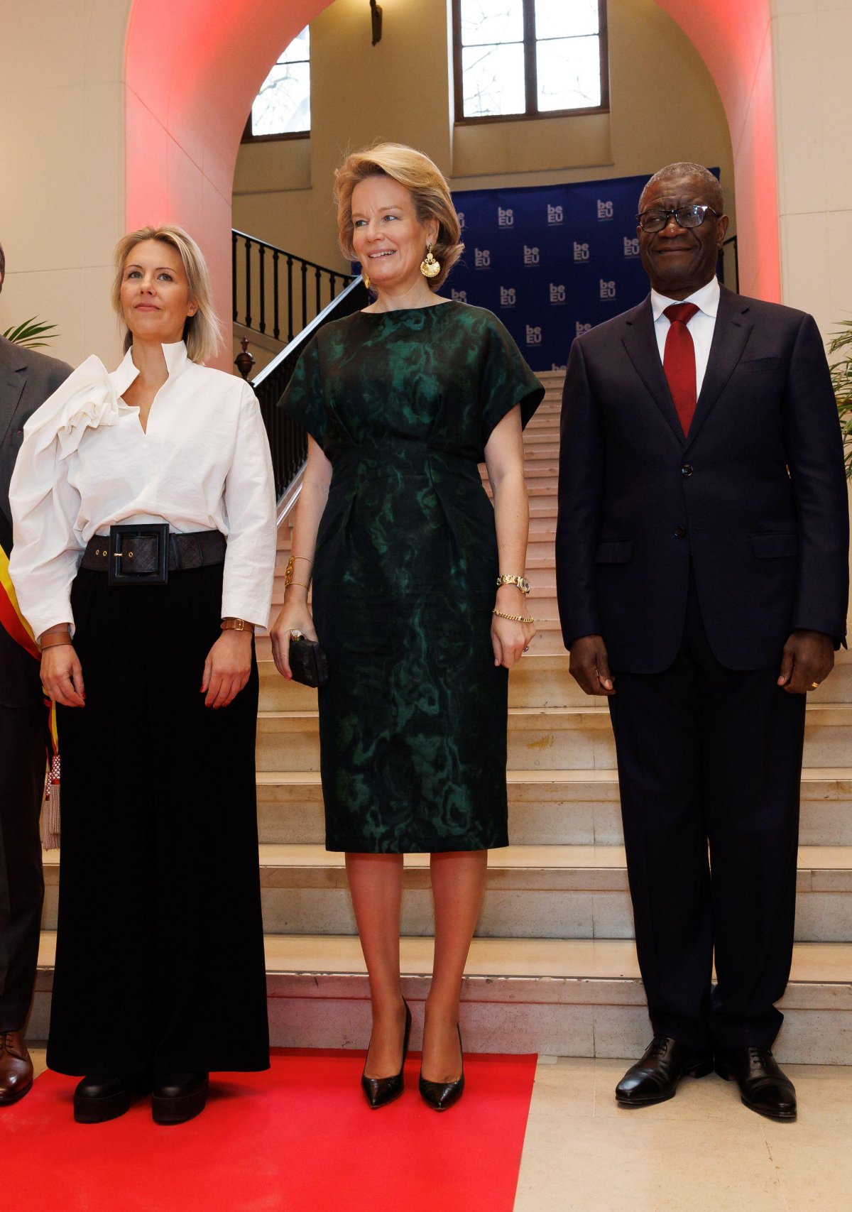 The Queen of the Belgians, with Defence Minister Ludivine Dedonder and Dr. Denis Mukwege of the DRC Congo, attends a seminar in Tournai on March 21, 2024 (KURT DESPLENTER/Belga News Agency/Alamy)