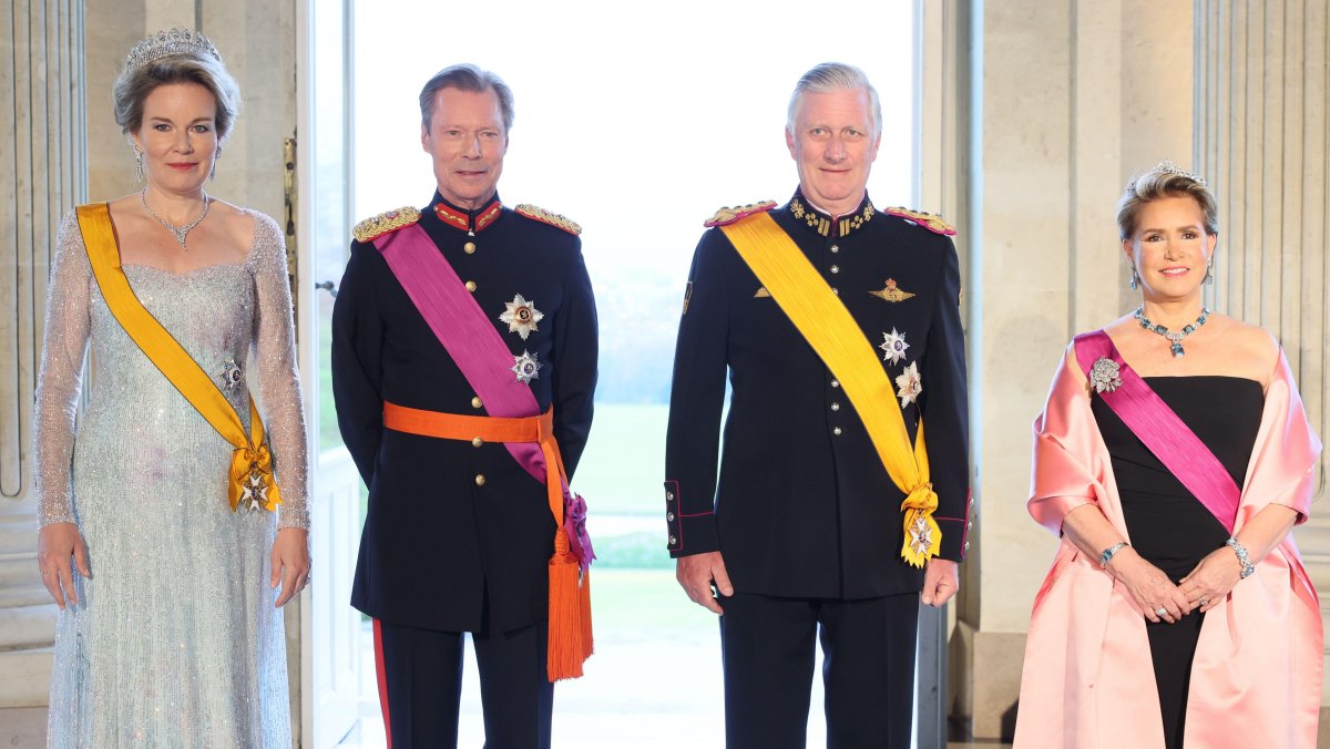 Queen Mathilde of the Belgians, Grand Duke Henri of Luxembourg, King Philippe of the Belgians, and Grand Duchess Maria Teresa of Luxembourg attend a state banquet at the Palace of Laeken on April 16, 2024 (BENOIT DOPPAGNE/Belga News Agency/Alamy)