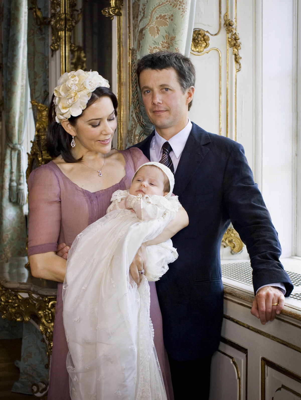 Crown Prince Frederik and Crown Princess Mary of Denmark pose with their infant daughter, Princess Isabella, at Fredensborg Palace after her christening on July 1, 2007 (Steen Brogaard/AFP/Getty Images)