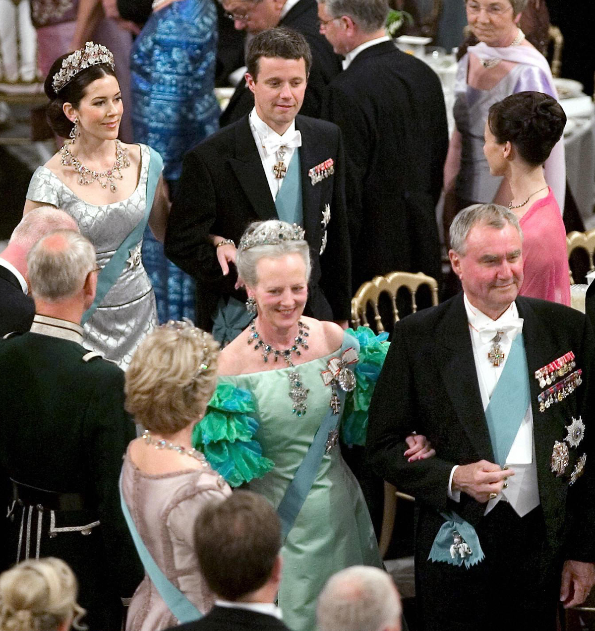 Queen Margrethe II and Prince Henrik of Denmark, followed by Crown Prince Frederik and Mary Donaldson, arrive for a government gala dinner at Christiansborg Palace in Copenhagen on May 11, 2004 (KELD NAVNTOFT/SCANPIX/Getty Images)