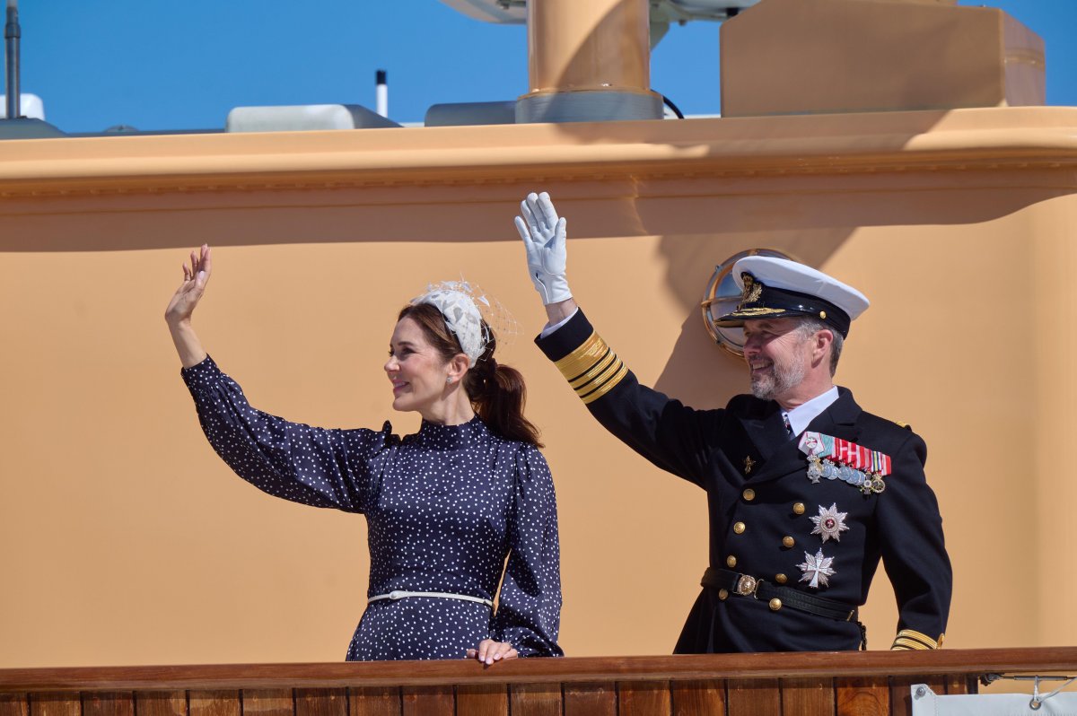 The King and Queen of Denmark wave from the deck of the Royal Yacht Dannebrog on May 2, 2024 (Stefan Lindblom/TT News Agency/Alamy)