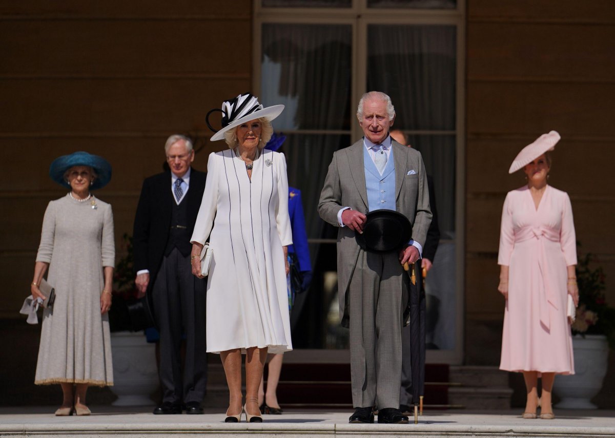 King Charles III and Queen Camilla of the United Kingdom, with the Princess Royal, the Duke and Duchess of Edinburgh, and the Duke and Duchess of Gloucester, attend a garden party at Buckingham Palace in London on May 8, 2024 (Jordan Pettitt/PA Images/Alamy)