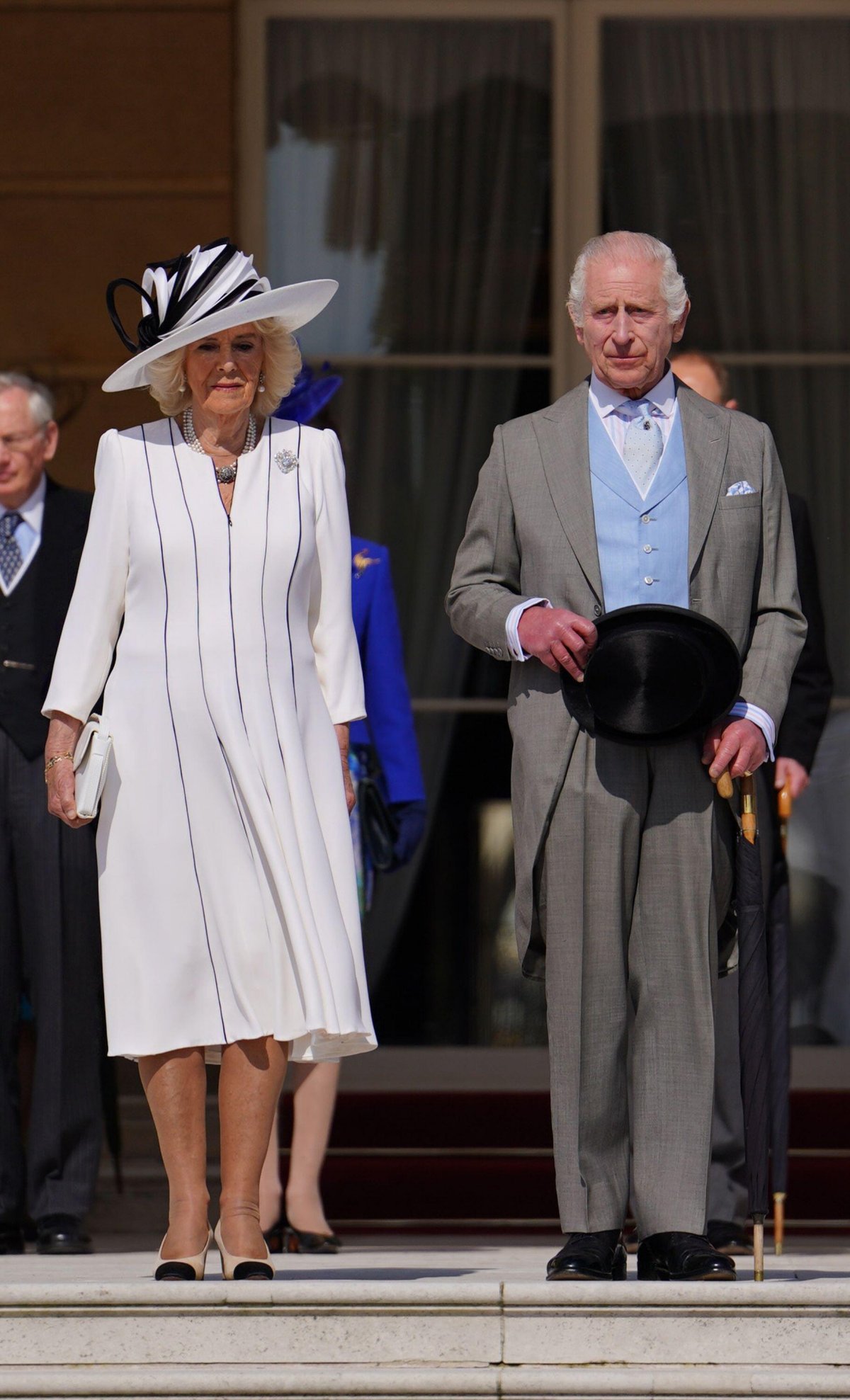 King Charles III and Queen Camilla of the United Kingdom attend a garden party at Buckingham Palace in London on May 8, 2024 (Jordan Pettitt/PA Images/Alamy)