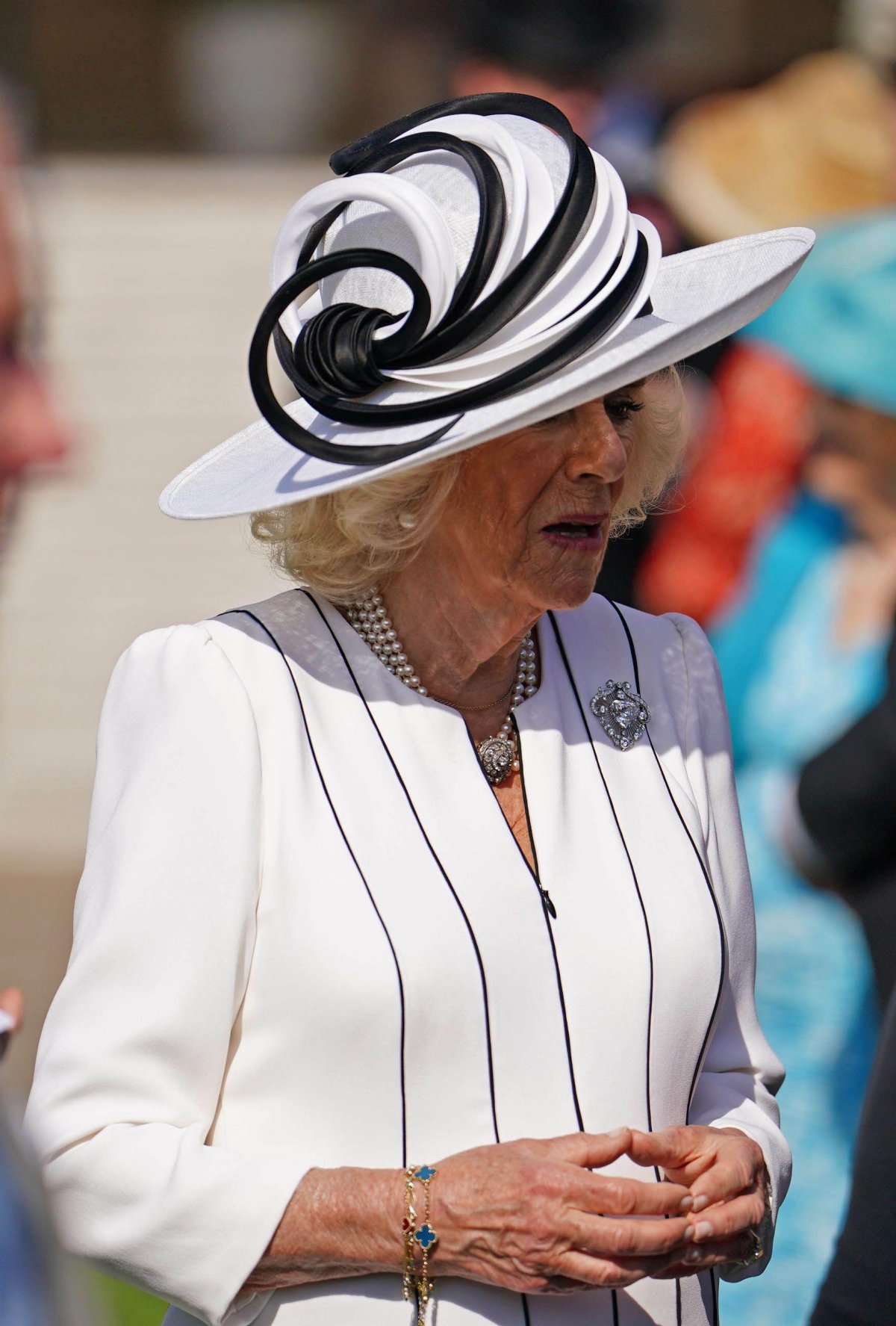 Queen Camilla of the United Kingdom attends a garden party at Buckingham Palace in London on May 8, 2024 (Jordan Pettitt/PA Images/Alamy)