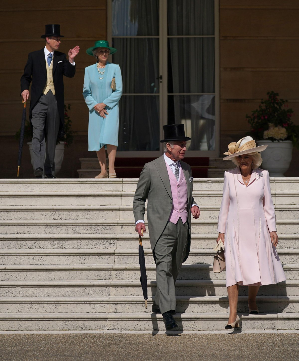King Charles III and Queen Camilla of the United Kingdom, with the Duke of Edinburgh and the Duchess of Gloucester, attend a garden party at Buckingham Palace in London on May 15, 2024 (Yui Mok/PA Images/Alamy)