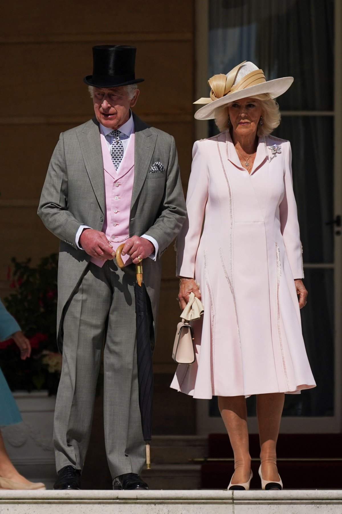King Charles III and Queen Camilla of the United Kingdom attend a garden party at Buckingham Palace in London on May 15, 2024 (Yui Mok/PA Images/Alamy)