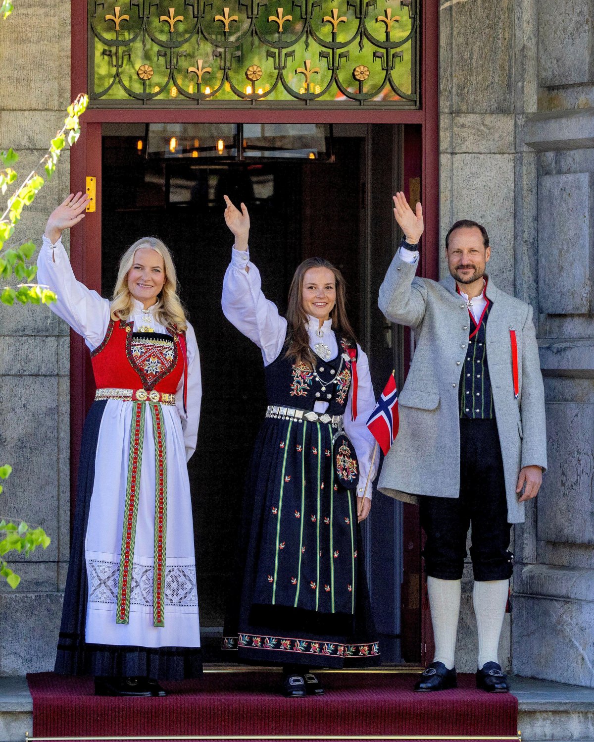 Crown Prince Haakon, Crown Princess Mette-Marit, and Princess Ingrid Alexandra of Norway celebrate National Day on the Skaugum estate in Asker on May 17, 2024 (Albert Nieboer/DPA Picture Alliance/Alamy)