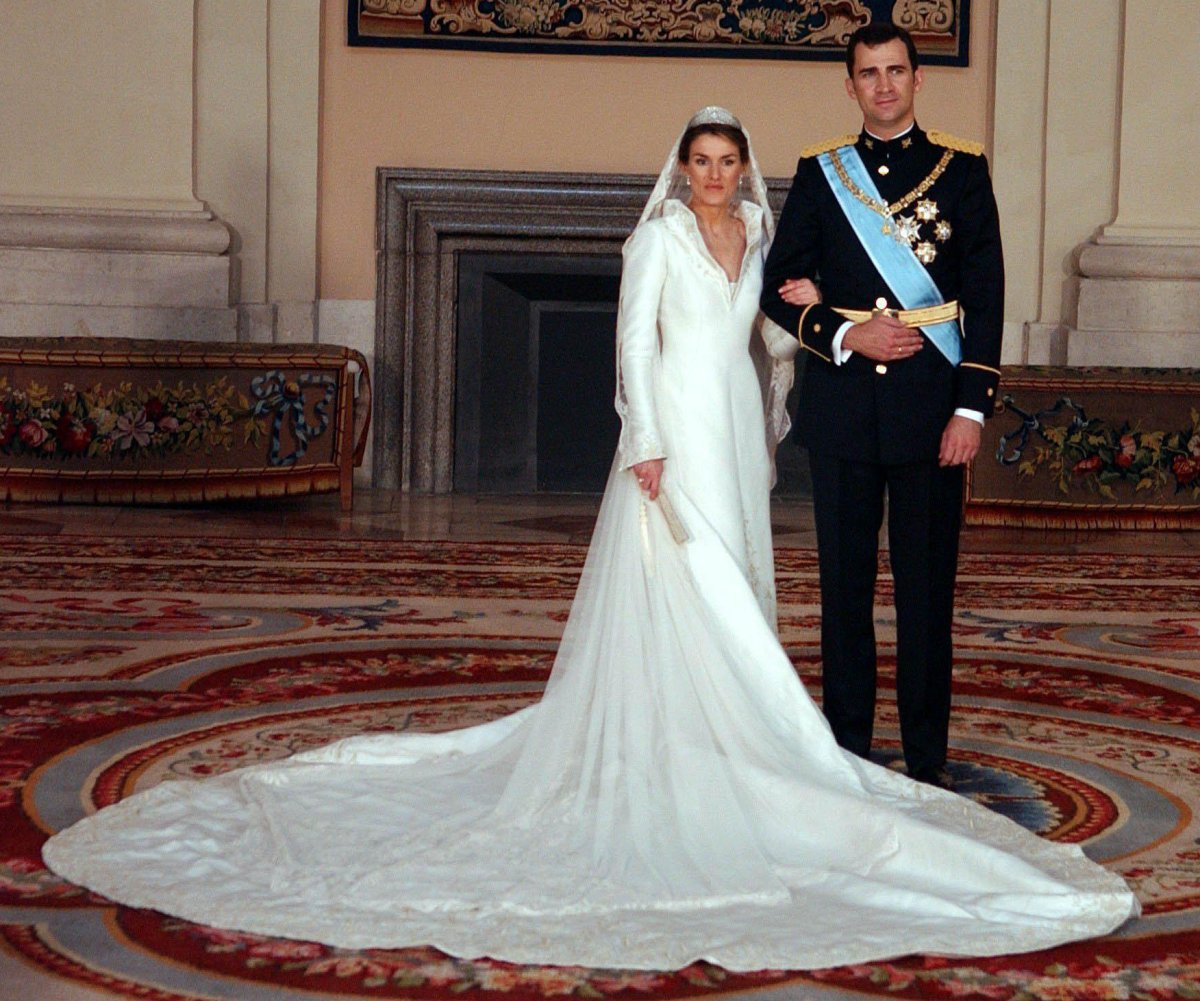 The Prince and Princess of Asturias pose for an official portrait at the Royal Palace in Madrid after their royal wedding ceremony on May 22, 2004 (DPA Picture Alliance Archive/Alamy)