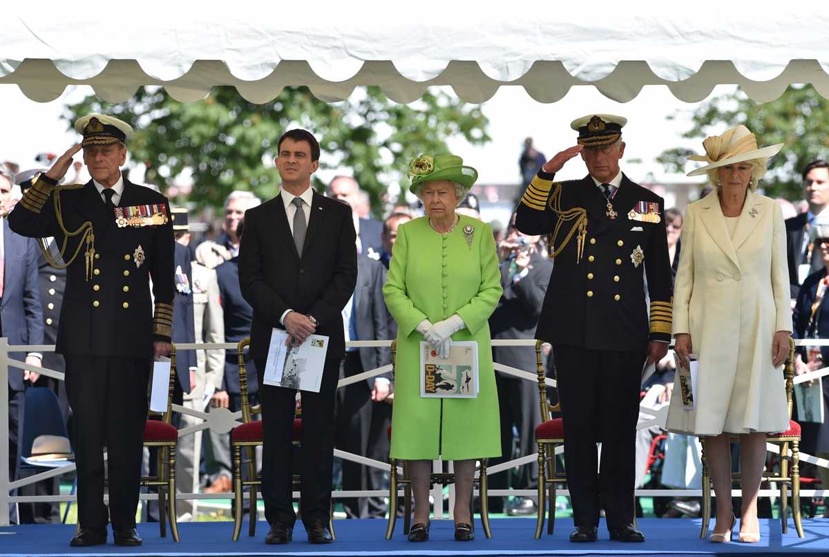 Queen Elizabeth II and Prince Philip, with the Prince of Wales and the Duchess of Cornwall, attend a bi-national France-UK D-Day commemoration ceremony at the British War Cemetery in Bayeux on June 6, 2014 (LEON NEAL/AFP via Getty Images)