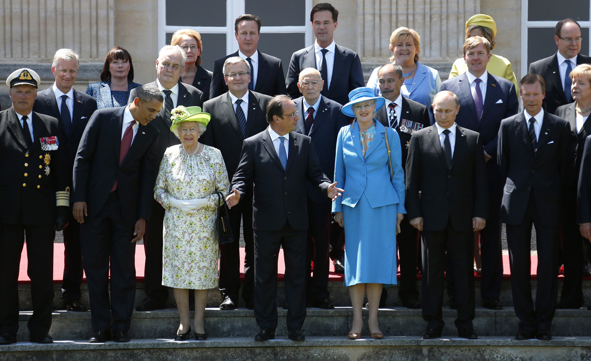World leaders pose for a group photo at Benouville Castle in France during the 70th anniversary commemorations of D-Day on June 6, 2014 (REGIS DUVIGNAU/AFP via Getty Images)