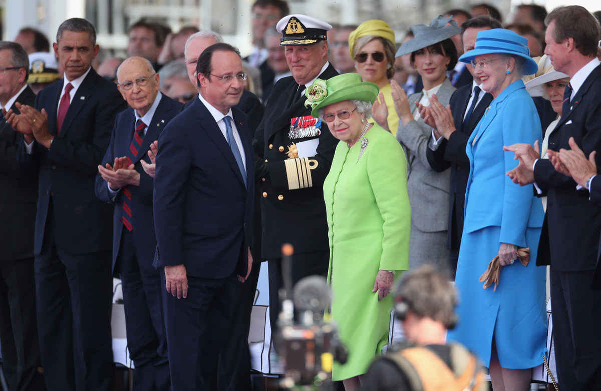 Queen Elizabeth II and French President Francois Hollande arrive for a ceremony of commemoration at Sword Beach in Normandy marking the 70th anniversary of D-Day on June 6, 2014 (Peter Macdiarmid/Getty Images)