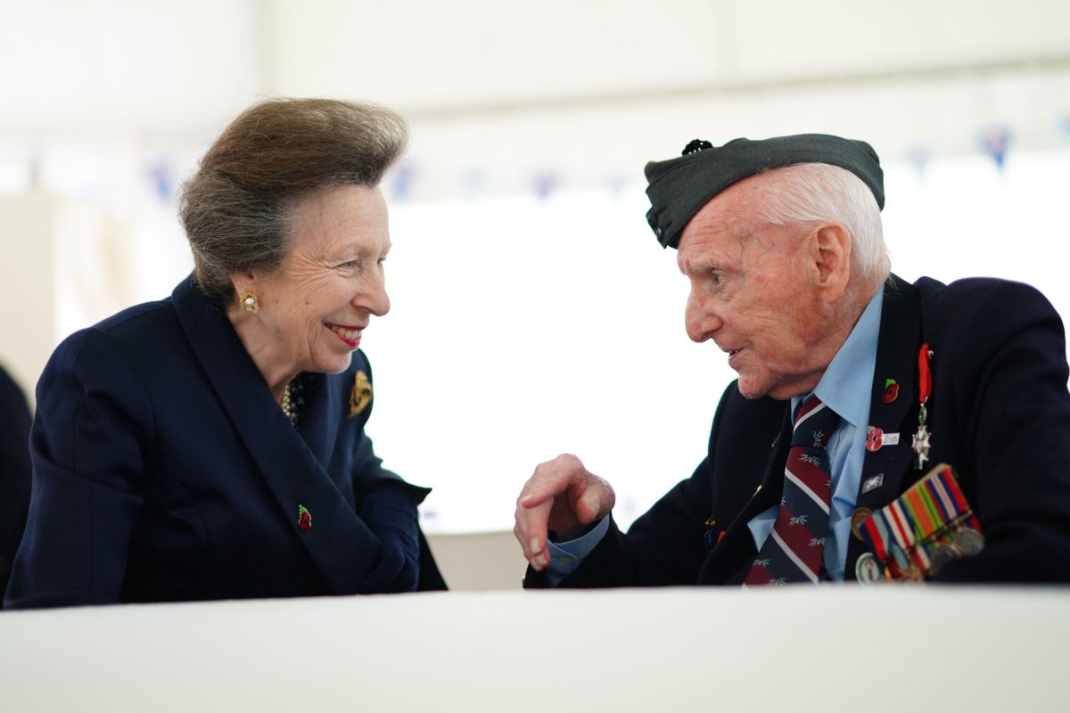The Princess Royal speaks with 100-year-old RAF veteran Bernard Morgan at the Royal British Legion Service of Commemoration to mark the 80th anniversary of D-Day at Bayeux War Cemetery in Normandy on June 5, 2024 (Aaron Chown/PA Images/Alamy)