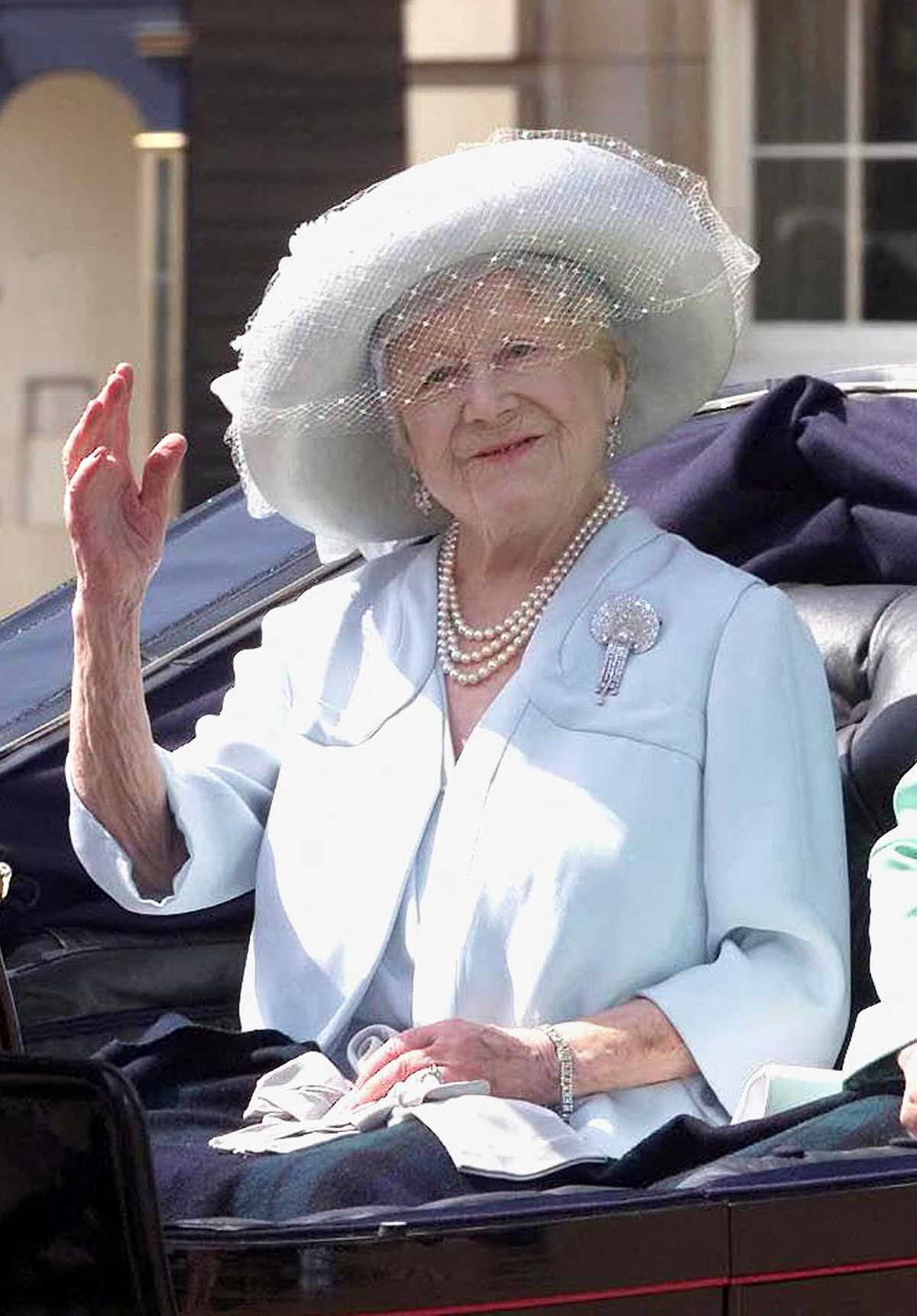 Queen Elizabeth the Queen Mother leaves Buckingham Palace in a carriage during the Trooping the Colour celebrations in London on June 17, 2000 (AFP via Getty Images)