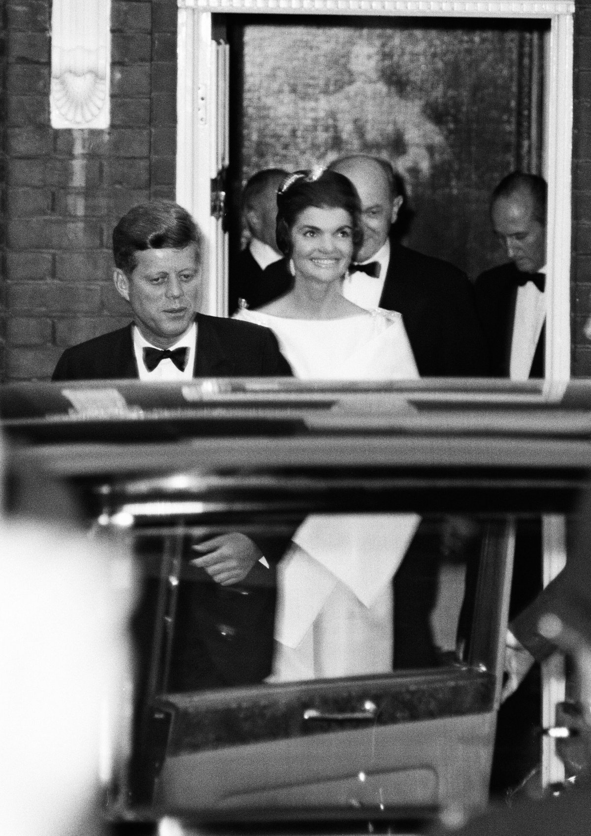 President John F. Kennedy and First Lady Jacqueline Kennedy leave the home of her sister, Lee Radziwill, en route to a dinner at Buckingham Palace in London on June 5, 1961 (Trinity Mirror/Mirrorpix/Alamy)