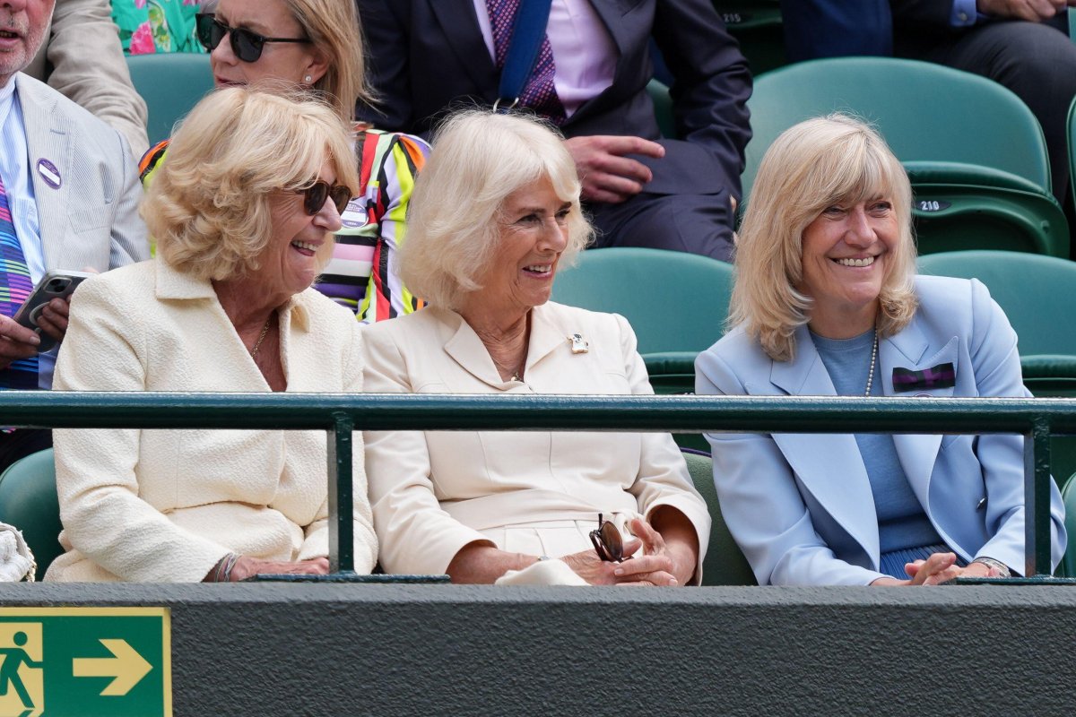 Annabel Elliot, Queen Camilla, and Debbie Jevans watch from the stands of Court One on day ten of the Wimbledon Championships at the All England Lawn Tennis and Croquet Club on July 10, 2024 (Jordan Pettitt/PA Images/Alamy)