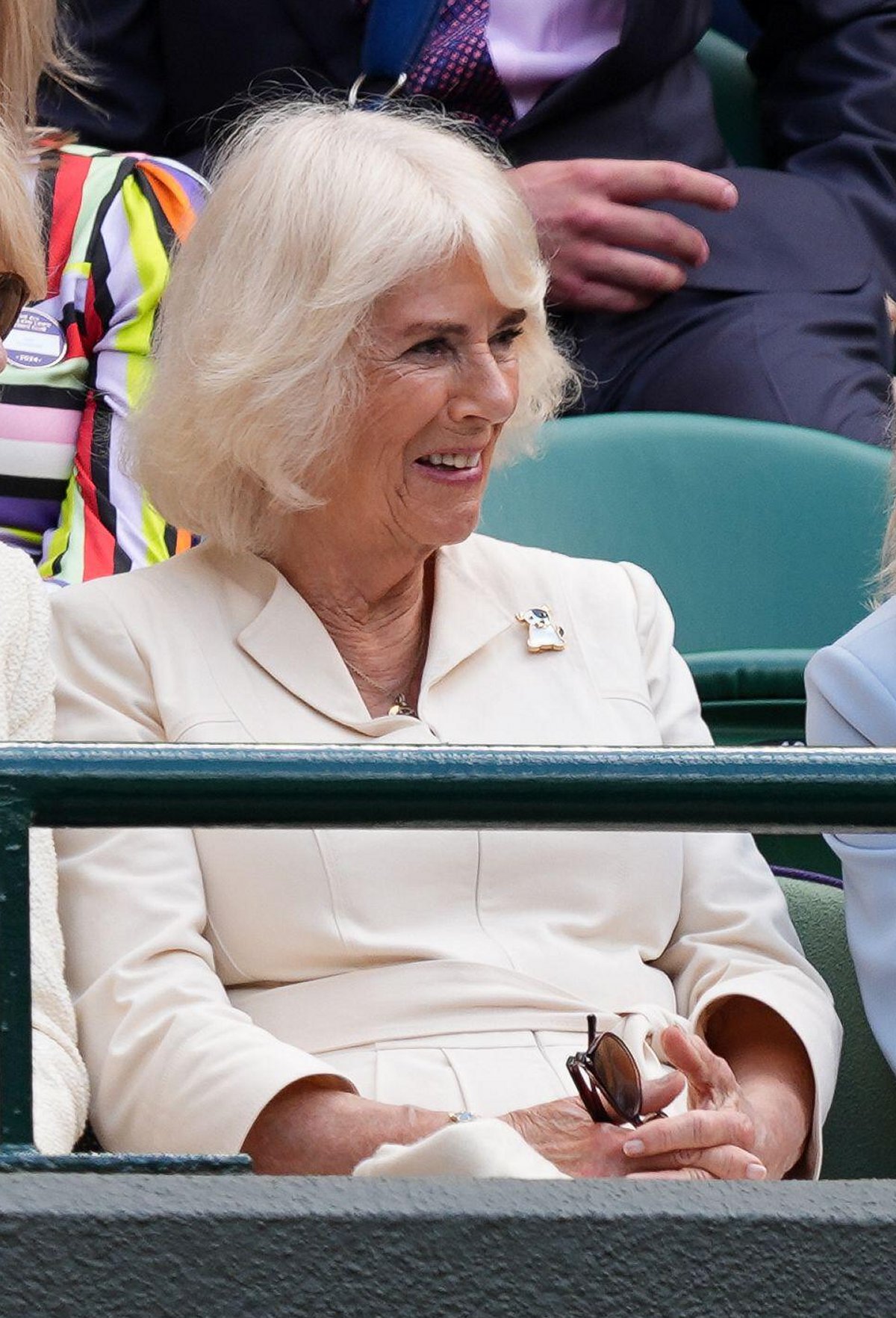 Queen Camilla watches from the stands of Court One on day ten of the Wimbledon Championships at the All England Lawn Tennis and Croquet Club on July 10, 2024 (Jordan Pettitt/PA Images/Alamy)