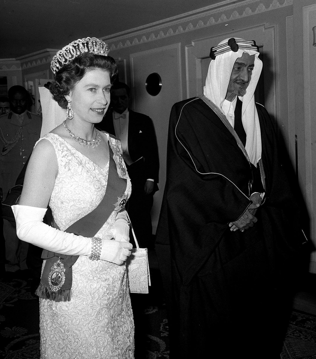 Queen Elizabeth II, with King Faisal of Saudi Arabia, arrives for a banquet at the Dorchester Hotel in London, May 1967 (PA Images/Alamy)