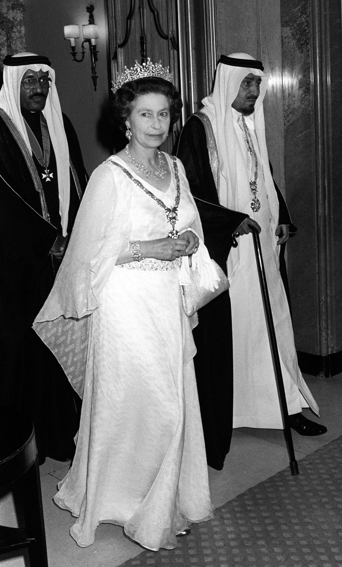 Queen Elizabeth II, with King Khalid of Saudi Arabia, departs after a return banquet at Claridge's Hotel during the Saudi state visit, June 1981 (PA Images/Alamy)